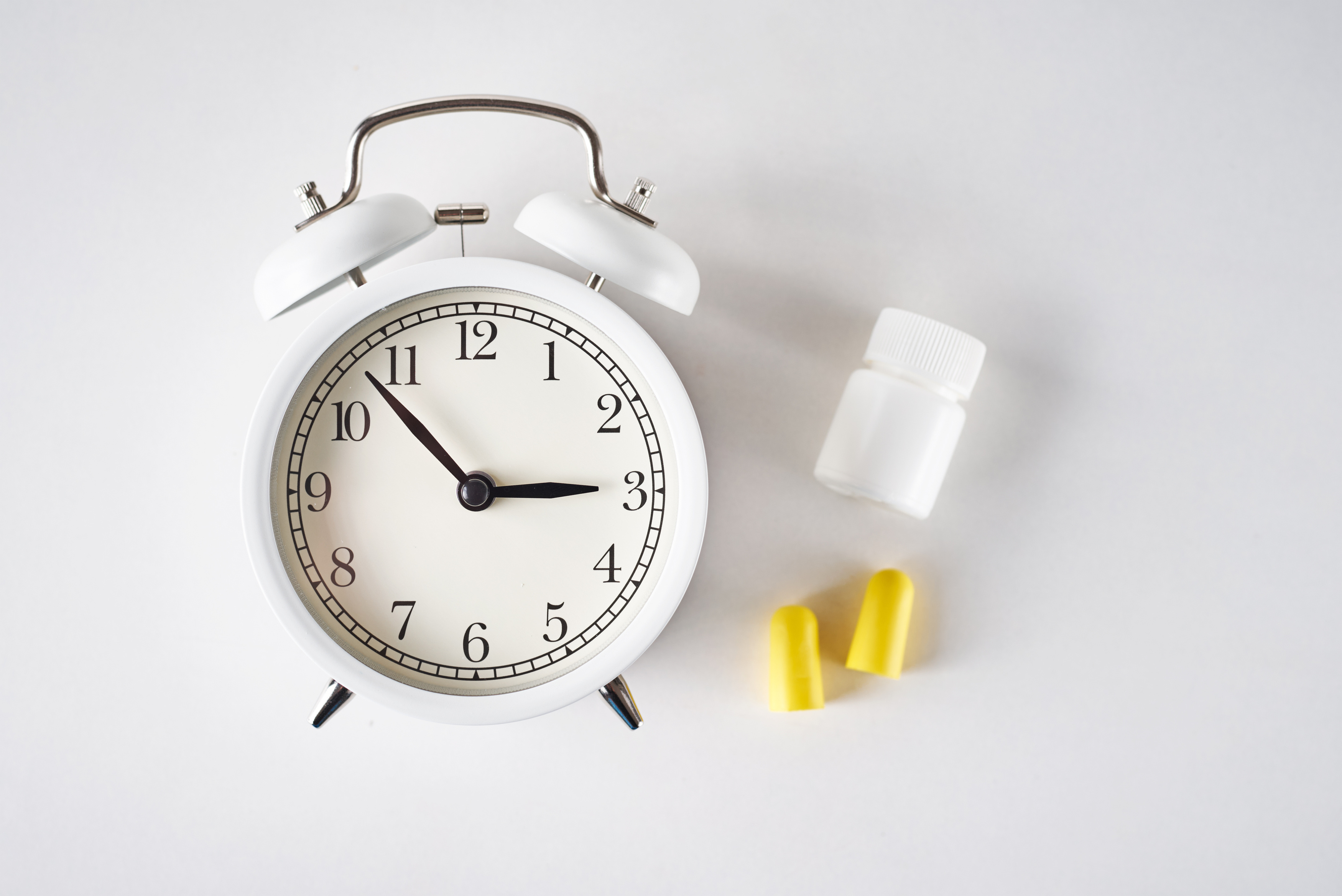 Alarm Clock with Ear Plugs and Pills
